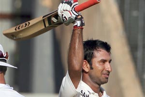 Cheteshwar Pujara celebrates his century during the first day of second India-England Test match at Wankhade Stadium in Mumbai. (PTI)