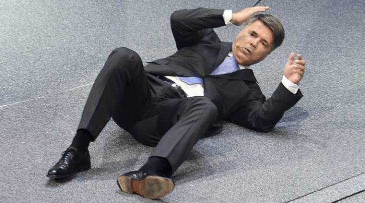 BMW CEO Harald Krueger collapses during the BMW presentation on the first press day of the Frankfurt Auto Show IAA in Frankfurt, Germany, Tuesday, Sept. 15, 2015. The car show runs through Sept. 27. (AP Photo/Jens Meyer)