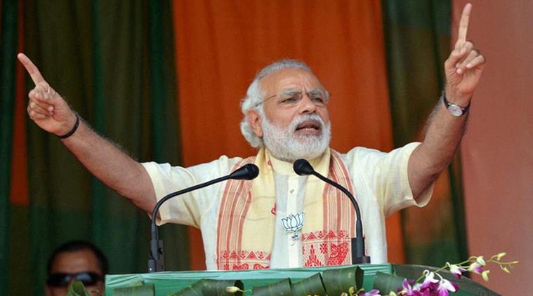 Tinsukia : Prime Minister Narendra Modi addresses an election rally at Tinsukia, Assam on Saturday. PTI Photo (PTI3_26_2016_000068B) *** Local Caption ***