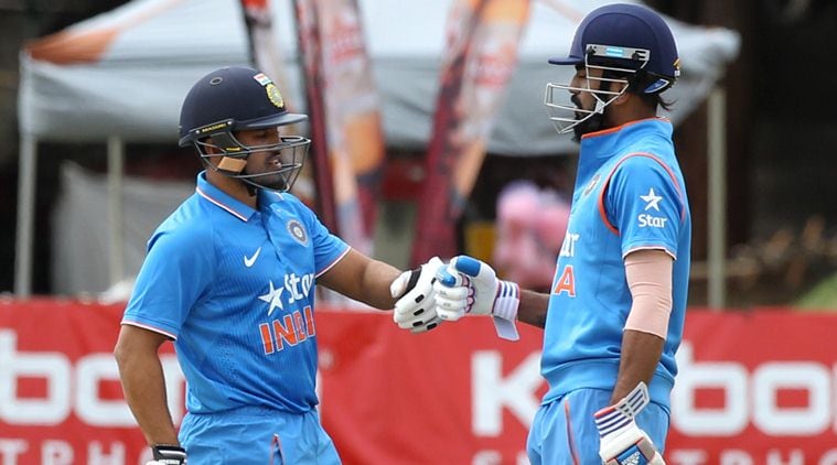 Indian batsman K Rahul, right, and Karun Nair touch gloves during their One Day International cricket match against Zimbabwe at Harare Sports Club, Monday, June 13, 2016. The Indian cricket team is in Zimbabwe for ODI and T20 matches.(AP Photo/Tsvangirayi Mukwazhi)