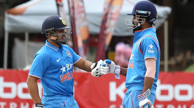 Indian batsman K Rahul, right, and Karun Nair touch gloves during their One Day International cricket match against Zimbabwe at Harare Sports Club, Monday, June 13, 2016. The Indian cricket team is in Zimbabwe for ODI and T20 matches.(AP Photo/Tsvangirayi Mukwazhi)