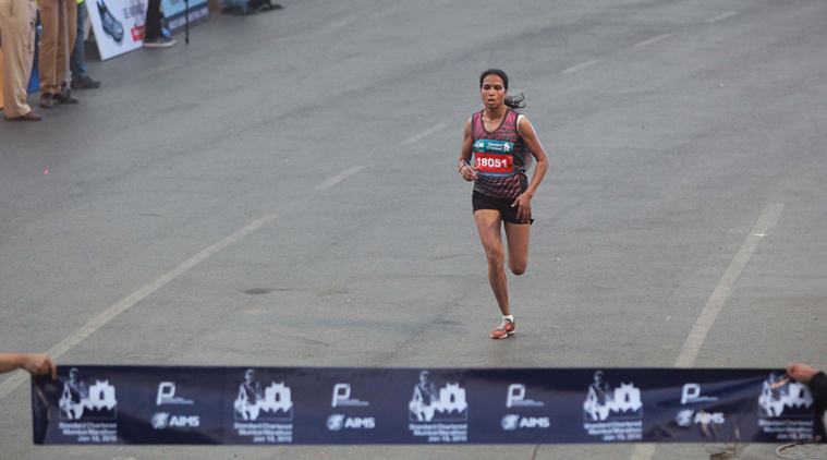 Kavita Raut, winners of the Half Mumbai Marathon 2015 at the finishng line at CST on Sunday. Express Photo by Kevin D'Souza. 18.01.2015. Mumbai.