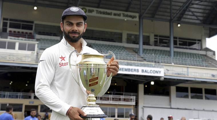 Port-of-Spain : India's captain Virat Kohli posses with the trophy during the award ceremony for the Test match series Royal Stag Cup at the Queen's Park Oval in Port-of-Spain, Trinidad, Monday, Aug. 22, 2016. India beat West Indies 2-0 in the series.AP/PTI(AP8_23_2016_000006B)