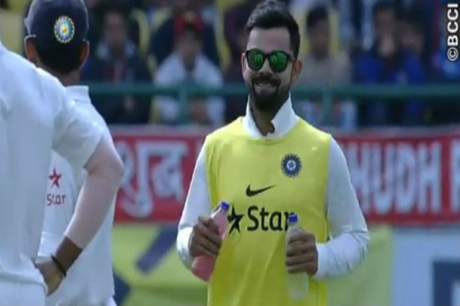 virat kohli, 12th man, carries drink