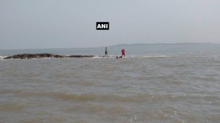 Mumbai , Three people saved by life guards , mishap, accident , Aksa beach , Aksa beach after they were trapped on a rock due to high tide , Loksatta, Loksatta news, Marathi, Marathi news