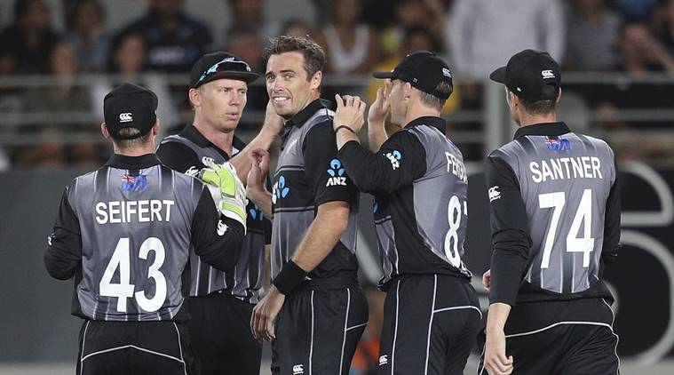 New Zealand's captain Tim Southee, center, is congratulated on taking a wicket of Sri Lanka's Kusal Mendis during their twenty/20 cricket international at Eden Park in Auckland, New Zealand, Friday, Jan. 11, 2019. (AP Photo/David Rowland)