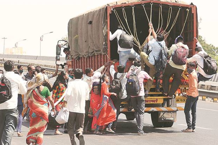 People stranded at Kalamboli, where the Mumbai-Pune Express Highway begins, took any transportation available to leave Mumbai on Monday. (Express photo by Narendra Vaskar)