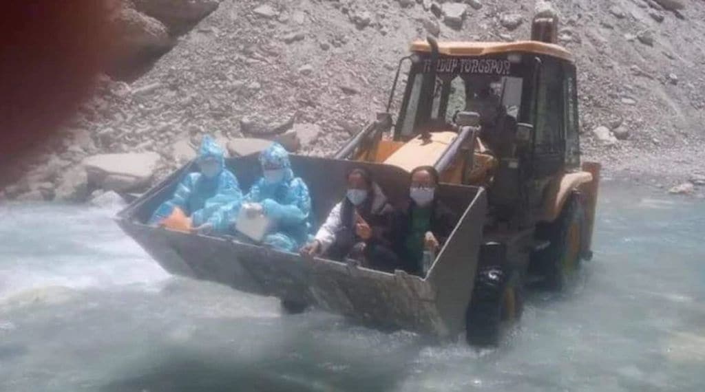 Covid 19 Warriors ride JCB machine to cross river Ladakh Photo Twitter Social Media Virual