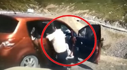 family Jumping Out Of Car As It Rolls Down Cliff