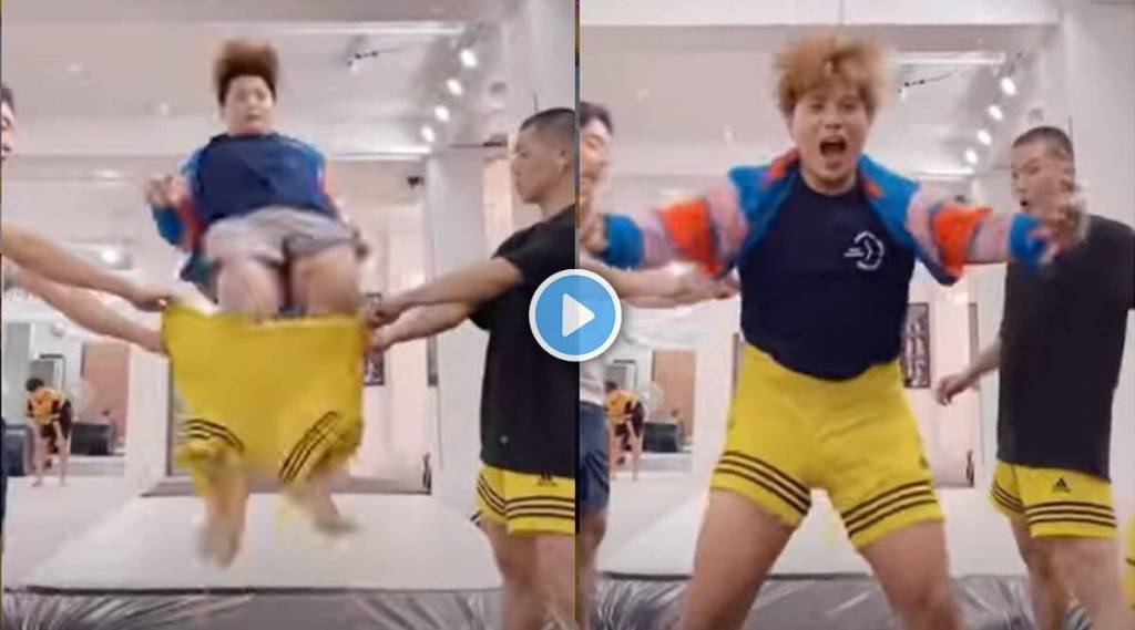 man-tries-to-wear-shorts-by-jumping-into-them
