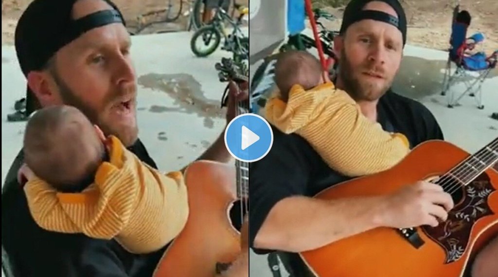 dad-strums-guitar-baby-on-shoulder-viral-video