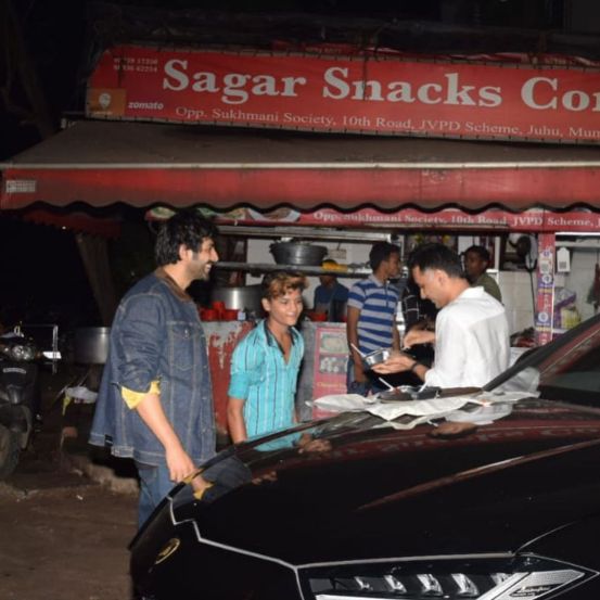 Chinese van food on Lamborghini bonnet Kartik Aaryan roadside foodscape on way back from Bigg Boss 15