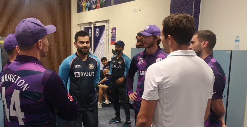 Scotland players visit Indian dressing room