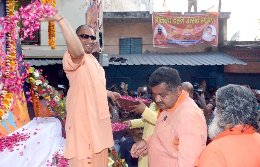 With sunglasses toy bulldozer Yogi Adityanath celebrates Holi in Gorakhpur See pics