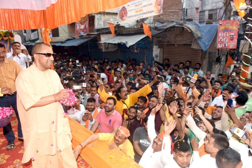 With sunglasses toy bulldozer Yogi Adityanath celebrates Holi in Gorakhpur See pics