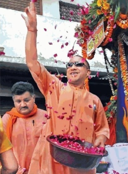 With sunglasses toy bulldozer Yogi Adityanath celebrates Holi in Gorakhpur See pics