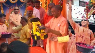 sunglasses toy bulldozer Yogi Adityanath celebrates Holi in Gorakhpur