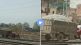 man drove a tractor on the railway tracks