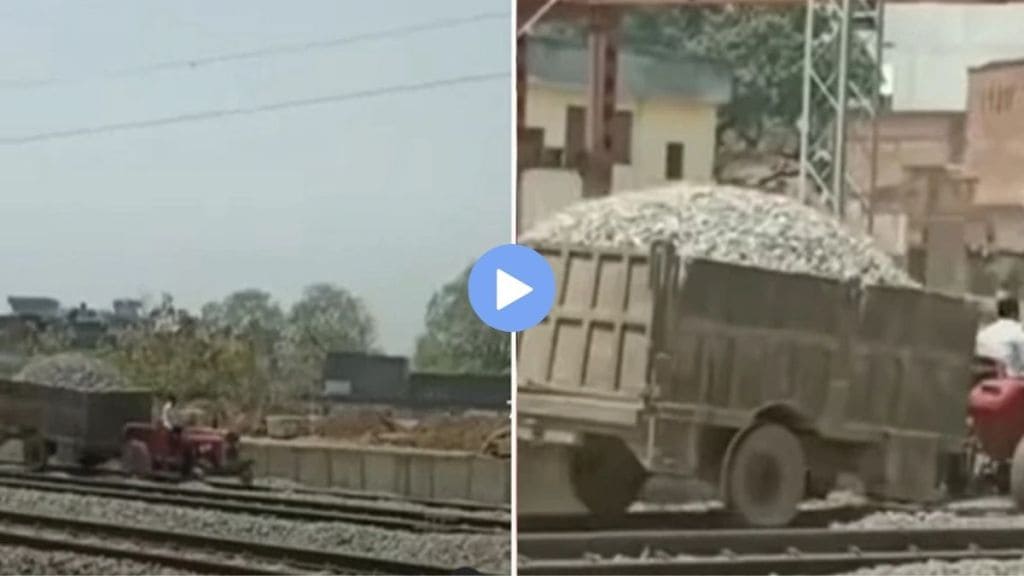 man drove a tractor on the railway tracks