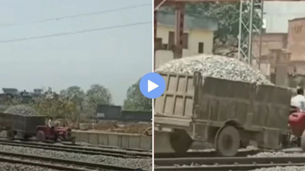 man drove a tractor on the railway tracks