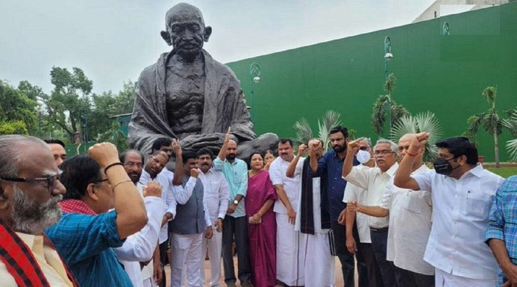 Suspended opposition MPs sit on dharna in front of Gandhi statue