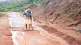 mud debris on road clean by two old man of satara