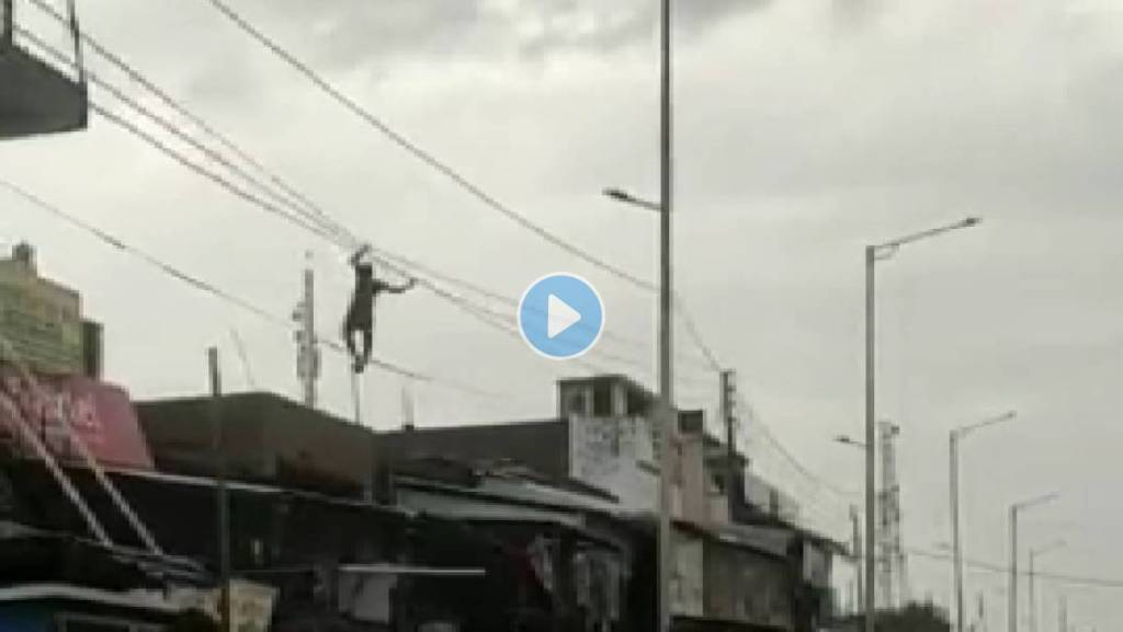 Man-Hanging-High-Tension-Line