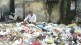 social activist sits on garbage heap protests to draw the attention of municipal corporation serious problem garbage kalyan
