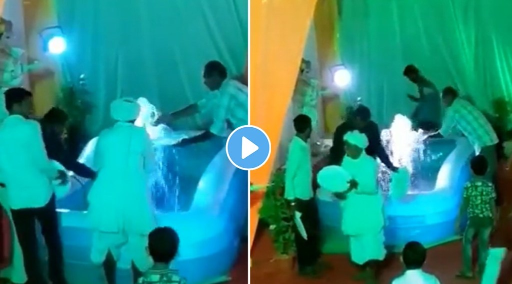 People were seen washing plates from water fountain in a village wedding