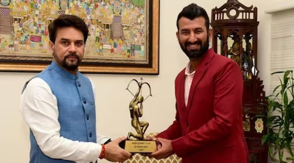 cheteshwar pujara receives his arjuna award after 5 years of wait sports minister anurag thakur visits pujara home to present award