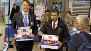 Prime Minister Rishi Sunak seen selling poppies at a London tube station