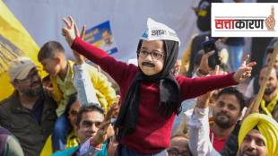 A child dressed as Delhi Chief Minister Arvind Kejriwal takes part in the celebrations of AAP's victory in the MCD polls, in New Delhi