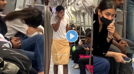 man enter metro wearing a towel
