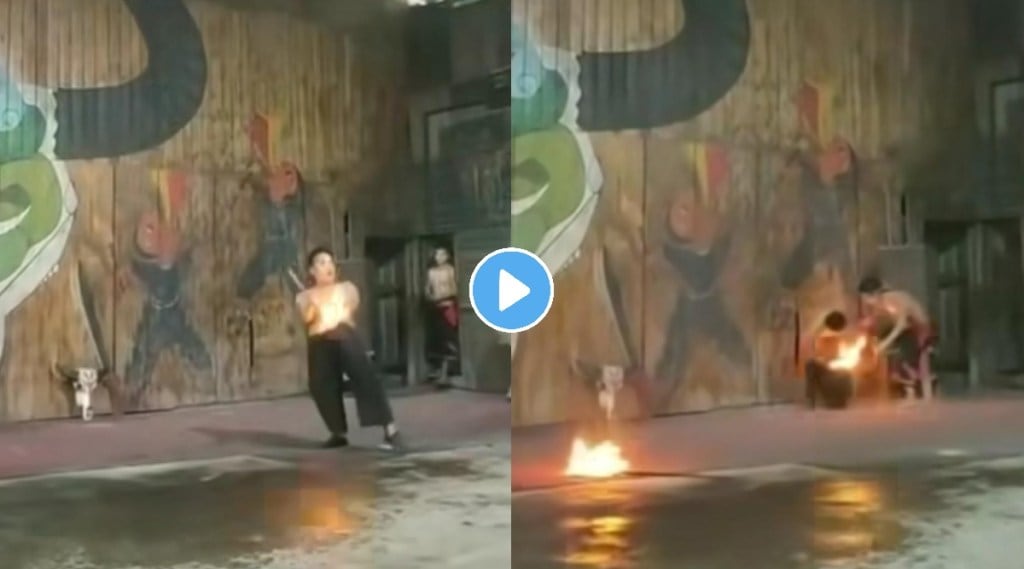 man doing dangerous stunt with fire