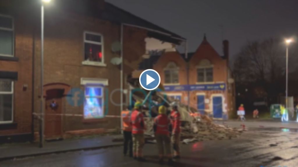 Building collapses after car hit