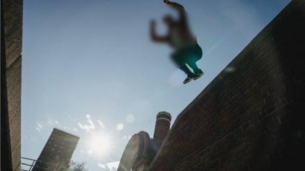 Youth jumps from building