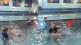 Mother throws baby in swimming pool