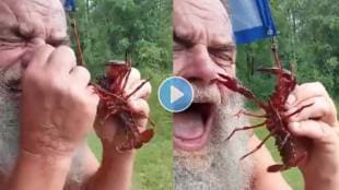 Old man tries to play with crab