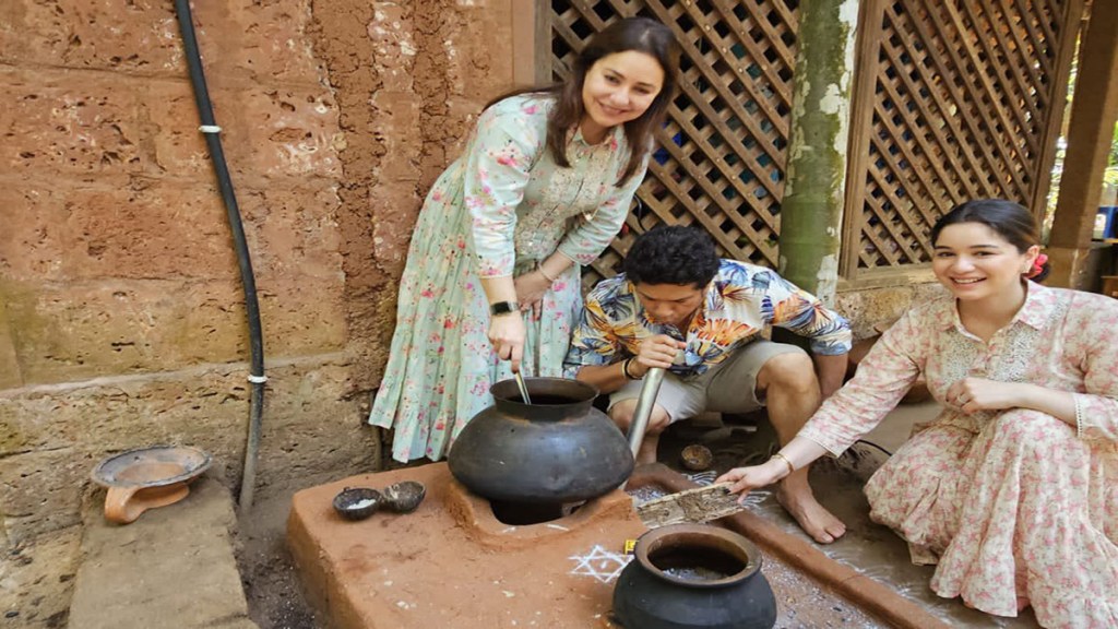 Sachin Tendulkar cooking in pot on wooden fire using blower and enjoying with his family