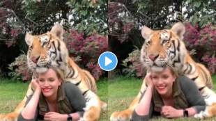 woman gave pose with tiger for photoshoot
