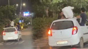 Viral Video of youngsters drinking alcohol and doing push ups on roof of the moving car