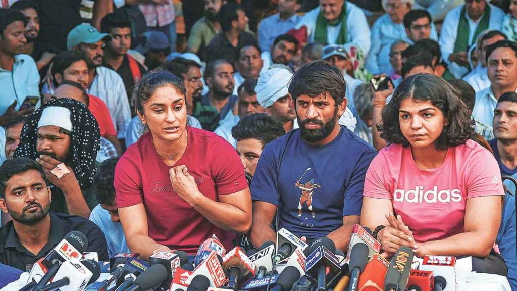 protesting wrestlers threaten to return medals awards after after delhi police action