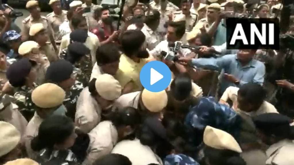Security personnel stop & detain protesting wrestlers as they try to march towards the new Parliament from their site of protest at Jantar Mantar
