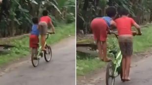 adorable video of two boys riding a bicycle in a funny way see desi jugaad