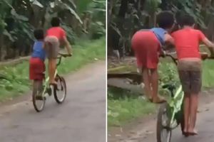 adorable video of two boys riding a bicycle in a funny way see desi jugaad