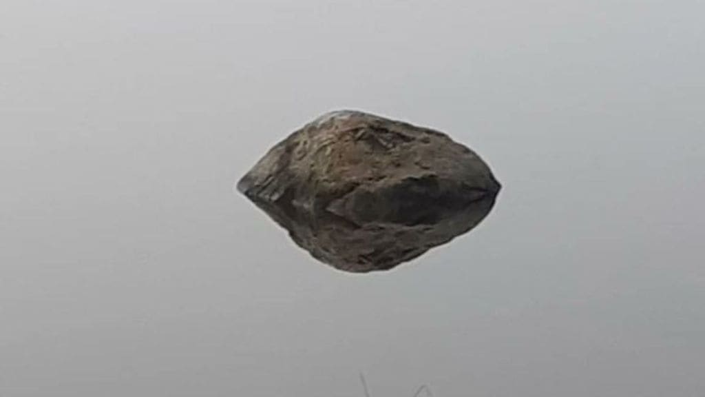 is this rock floating in water or flying in the air viral optical illusion confused internet