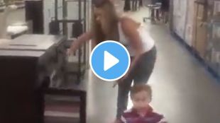 mother show a chappal footwear to her child