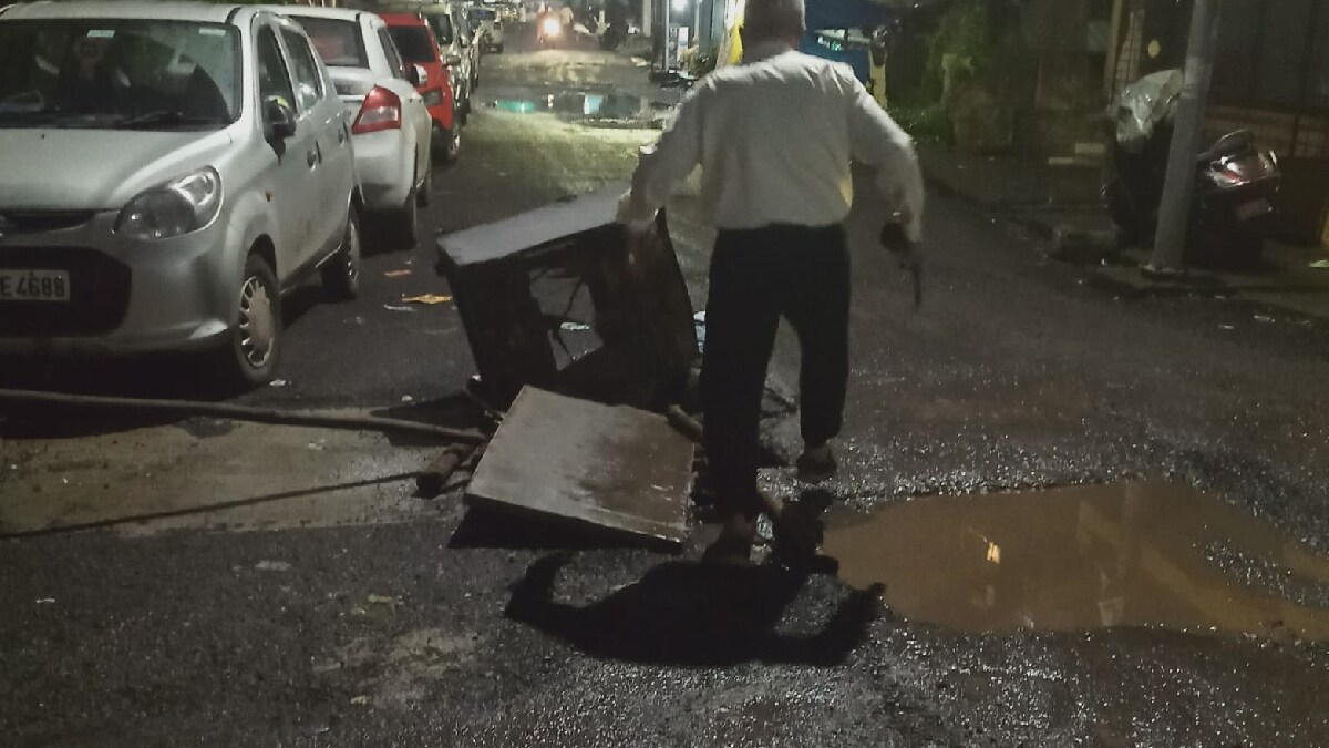 Broken pothole on the road in Navapada area in Dombivli