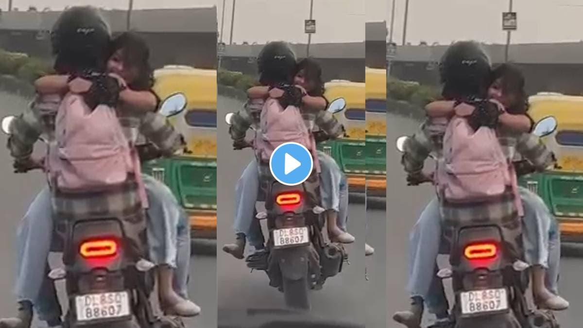 Couple doing romance while driving bike on delhi road and break traffic rules then what happened video trending of internet