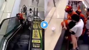 Boy gets stuck between escalator and wall